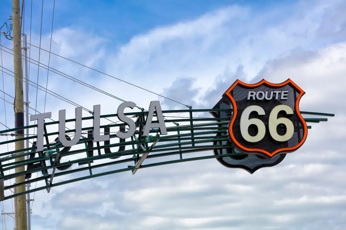 The Tulsa Route 66 gateway sign against a blue sky